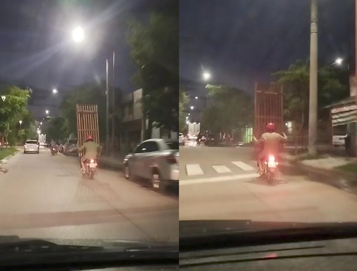 Una cama en una moto: filman un imprudente traslado en Avenida Colón